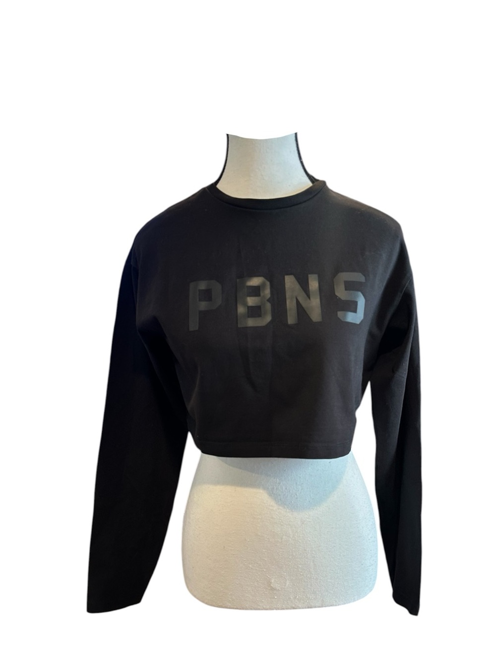 black Alphalete PBNS cropped long-sleeve athletic t-shirt.